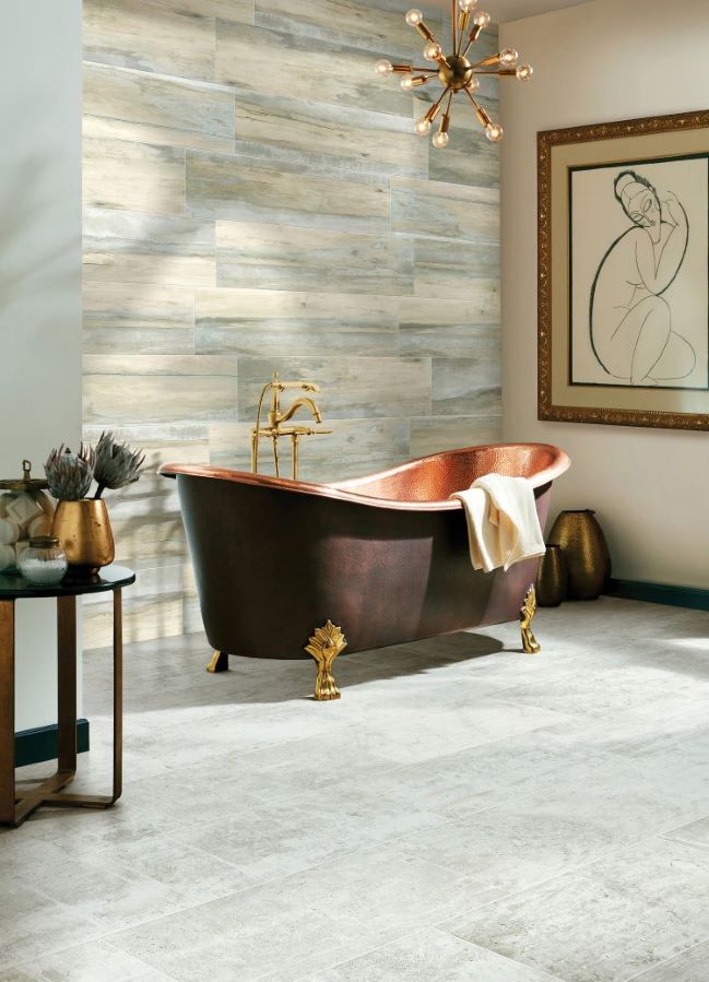 waterproof grey tile flooring in a modern bathroom with freestanding copper tub