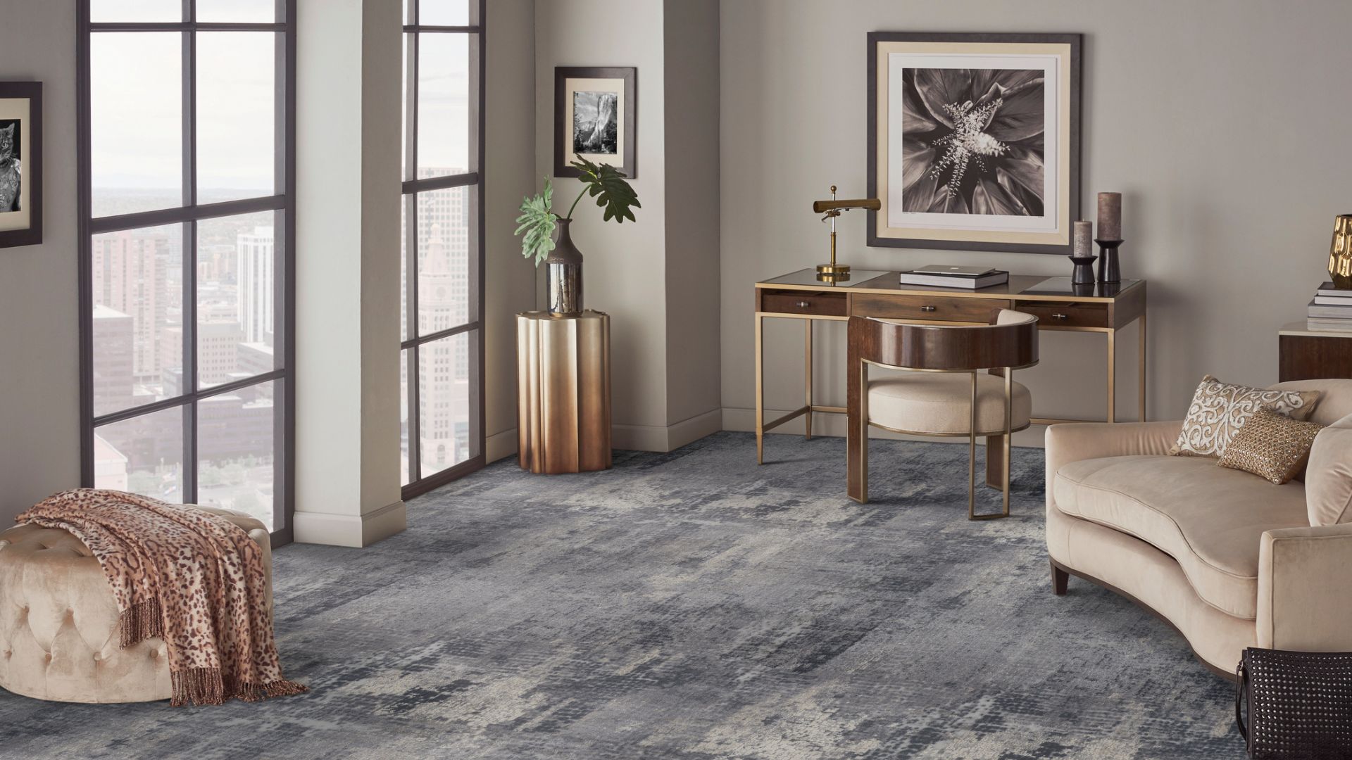 blue and grey patterned carpet in a stylish living room with couch and desk