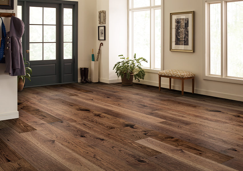 warm toned hardwood flooring in entryway